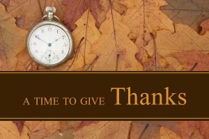 Thankful message Some fall leaves and retro pocket watch with text A Time to give Thanks